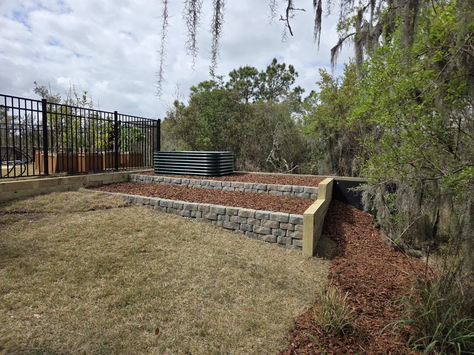 Stepped retaining beds beside a lawn on Johns Island