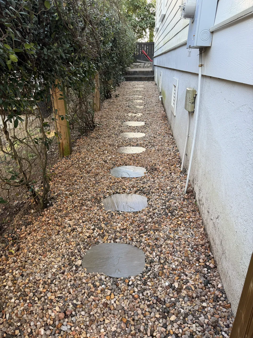 Stepping stones through a gravel side-yard path