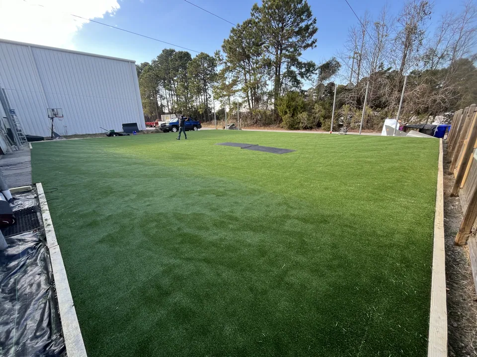 Outdoor artificial sports turf beside a commercial building in Mount Pleasant