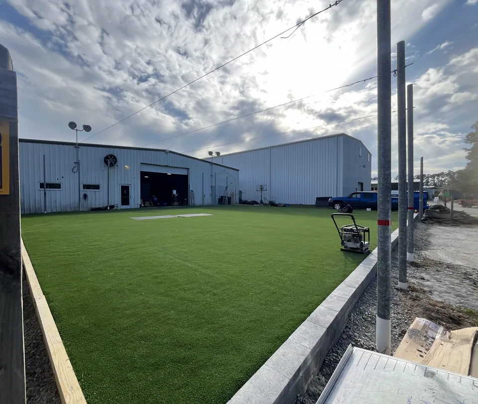 View across the sports turf toward the commercial building